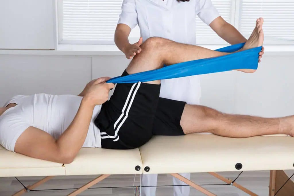 Physical therapist evaluating knee movement for meniscus tear symptoms