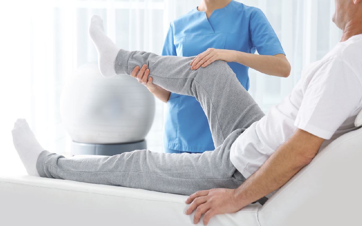 Patient recovering with physical therapist guidance