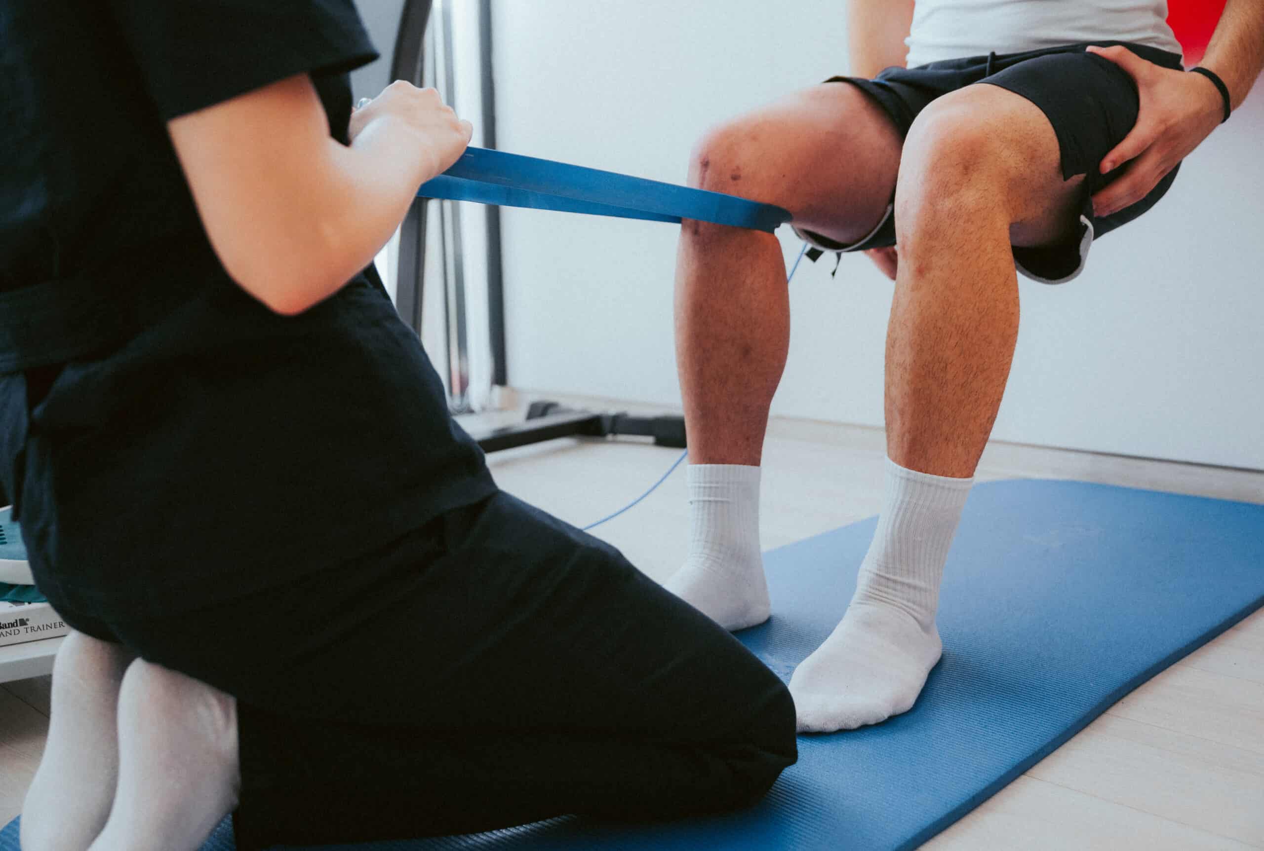 physical therapist evaluating patient knee mobility